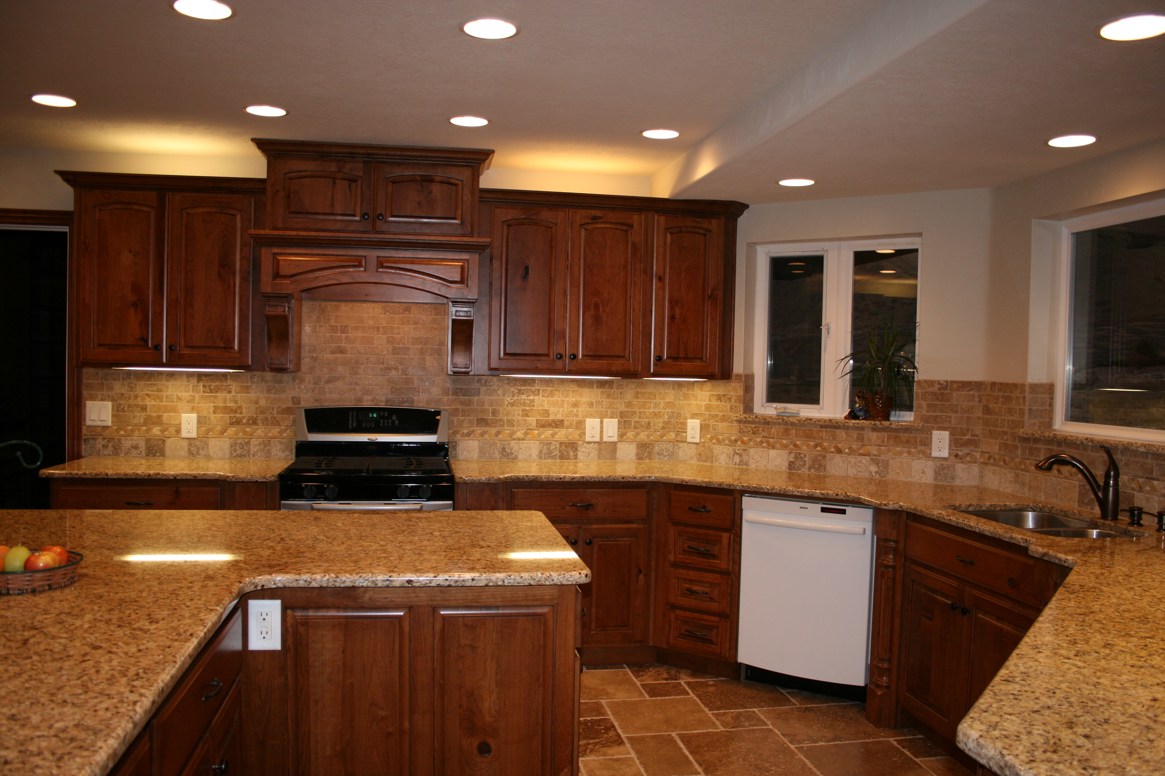 Cherry Cabinets with Granite Countertops and Backsplash